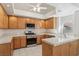 Kitchen with tile floors, oak cabinets, and stainless steel oven at 7501 Bush Garden Ave, Las Vegas, NV 89129
