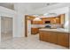Eat-in kitchen with oak cabinets, white tile counters, and tile floors at 7501 Bush Garden Ave, Las Vegas, NV 89129