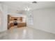 Bright living room with tile floors open to the kitchen with oak cabinets at 7501 Bush Garden Ave, Las Vegas, NV 89129