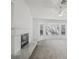 Bright living room features a fireplace, plush carpet and large windows at 7501 Bush Garden Ave, Las Vegas, NV 89129