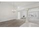 Spacious living room with high ceilings, fireplace, and elegant chandelier at 7501 Bush Garden Ave, Las Vegas, NV 89129