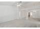 Bright living room with neutral paint, plush carpet, tiled floors and elegant chandelier at 7501 Bush Garden Ave, Las Vegas, NV 89129