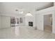 Spacious living room with tile floors, fireplace, and sliding door at 7501 Bush Garden Ave, Las Vegas, NV 89129