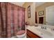 Cozy bathroom with a classic vanity, toilet, mirror, and neutral color palette at 7815 Red Rock Ridge Ave, Las Vegas, NV 89179
