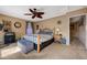 Comfortable bedroom with neutral tones, ceiling fan, and well-lit interior; a peaceful retreat at 7815 Red Rock Ridge Ave, Las Vegas, NV 89179