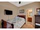 Comfortable bedroom with a bed, TV, and an en-suite bathroom at 7815 Red Rock Ridge Ave, Las Vegas, NV 89179