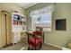 Bright bedroom featuring a desk, chair, and a large window offering natural light at 7815 Red Rock Ridge Ave, Las Vegas, NV 89179