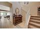 Inviting foyer with tile flooring, staircase and decorative furnishings at 7815 Red Rock Ridge Ave, Las Vegas, NV 89179