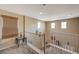 Bright hallway with carpet flooring, white staircase railing, and neutral walls at 7815 Red Rock Ridge Ave, Las Vegas, NV 89179