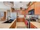 Gourmet kitchen with stainless steel appliances and granite countertops and ample cabinet space at 7815 Red Rock Ridge Ave, Las Vegas, NV 89179
