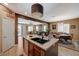 Large kitchen island featuring stainless steel appliances and lots of natural light at 7815 Red Rock Ridge Ave, Las Vegas, NV 89179