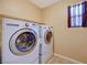 Functional laundry room equipped with modern washer and dryer appliances at 7815 Red Rock Ridge Ave, Las Vegas, NV 89179
