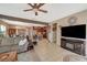 Spacious living room showcasing tile flooring, recessed lighting, and an entertainment center at 7815 Red Rock Ridge Ave, Las Vegas, NV 89179