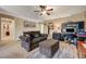 Cozy room with a comfortable sofa, ottoman, desk, and ceiling fan at 7815 Red Rock Ridge Ave, Las Vegas, NV 89179