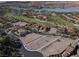 Breathtaking aerial view of vacant land for sale surrounded by a luxurious golf course community with lake views at 8 Via Verona Ct, Henderson, NV 89011