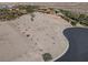Unobstructed aerial view of vacant residential land for sale in a well-maintained community with mountain views at 8 Via Verona Ct, Henderson, NV 89011