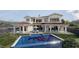 Stunning home featuring a private pool, covered patios, and lush landscaping, perfect for outdoor entertaining at 8 Via Verona Ct, Henderson, NV 89011