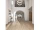 Bright, airy foyer with soaring ceilings, hardwood floors, archways, and a modern chandelier at 8 Via Verona Ct, Henderson, NV 89011