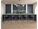 Modern kitchen featuring a green island with seating and state-of-the-art appliances at 8 Via Verona Ct, Henderson, NV 89011