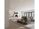 Comfortable living room with modern fireplace and access to patio through glass doors at 8 Via Verona Ct, Henderson, NV 89011