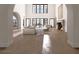 Open living room featuring high ceilings, a fireplace, and large windows at 8 Via Verona Ct, Henderson, NV 89011