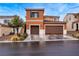 Charming two-story home with a two-car garage and landscaped front yard at 817 Great Sky Ct, North Las Vegas, NV 89084