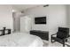 Bedroom with mounted tv, closet, and lounge chair at 8255 Las Vegas Blvd # 1908, Las Vegas, NV 89123