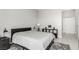 Bedroom with nightstands, black furniture, and grey rug on tile floors at 8255 Las Vegas Blvd # 1908, Las Vegas, NV 89123