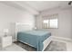 Bedroom featuring white bed frame, nightstand, and window with views of city at 8255 Las Vegas Blvd # 1908, Las Vegas, NV 89123