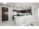 Modern kitchen with stainless steel appliances, breakfast bar, and tile flooring at 8255 Las Vegas Blvd # 1908, Las Vegas, NV 89123