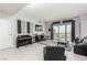 Open living area with a comfortable seating arrangement and expansive windows overlooking the city at 8255 Las Vegas Blvd # 1908, Las Vegas, NV 89123