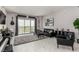 Bright living room with floor-to-ceiling windows, a cozy seating area, and city views at 8255 Las Vegas Blvd # 1908, Las Vegas, NV 89123