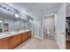Bathroom featuring a double sink vanity, shower with glass door, private toilet, and walk in closet at 8519 Little Fox St, Las Vegas, NV 89123