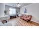 Bedroom with laminate floors, natural light, sofa bed and dresser at 8519 Little Fox St, Las Vegas, NV 89123