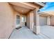 Inviting front porch leading to the front door and attached garage at 8519 Little Fox St, Las Vegas, NV 89123