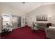 Bright living room features sliding glass doors and a comfortable seating arrangement at 8904 Marble Dr, Las Vegas, NV 89134