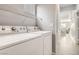 Laundry room with washer, dryer and view of stairs and living room at 9241 Placer Bullion Ave, Las Vegas, NV 89178