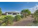 This backyard has landscaping, a pool, and a grass area at 9475 W Rosada Way, Las Vegas, NV 89149