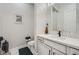 Elegant half bath featuring modern fixtures, stylish mirror, and neutral color scheme at 9475 W Rosada Way, Las Vegas, NV 89149