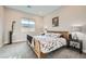 This bedroom features carpet, a window, a ceiling light, and a queen bed at 9475 W Rosada Way, Las Vegas, NV 89149