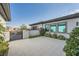 Private courtyard with tile flooring, tasteful landscaping, and a secure gate for added privacy at 9475 W Rosada Way, Las Vegas, NV 89149