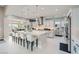 Bright, open kitchen with a large island, white cabinetry, stainless steel appliances, and pendant lighting at 9475 W Rosada Way, Las Vegas, NV 89149