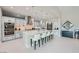 Elegant kitchen featuring a marble-topped island, pendant lights, and stainless steel appliances at 9475 W Rosada Way, Las Vegas, NV 89149