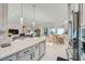 Open-concept kitchen and living area with modern design and ample space for entertaining at 9475 W Rosada Way, Las Vegas, NV 89149
