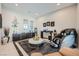 Comfortable living room featuring modern massage chair, neutral decor and plush rug at 9475 W Rosada Way, Las Vegas, NV 89149