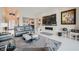 Stylish living room with modern fireplace, zebra art, and comfortable seating on tile floors at 9475 W Rosada Way, Las Vegas, NV 89149