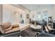 Cozy living room with modern decor, neutral colors, and sleek furniture arrangement with a plush rug at 9475 W Rosada Way, Las Vegas, NV 89149