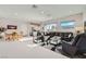 Open-concept living and dining area with modern furnishings and ample natural light at 9475 W Rosada Way, Las Vegas, NV 89149