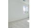 Bright bedroom with light-colored carpet and a window offering natural light and an outside view at 11940 Vector Ray Ave, Las Vegas, NV 89138