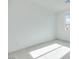 This bedroom offers a bright space with plush carpeting and natural light from the window at 11940 Vector Ray Ave, Las Vegas, NV 89138